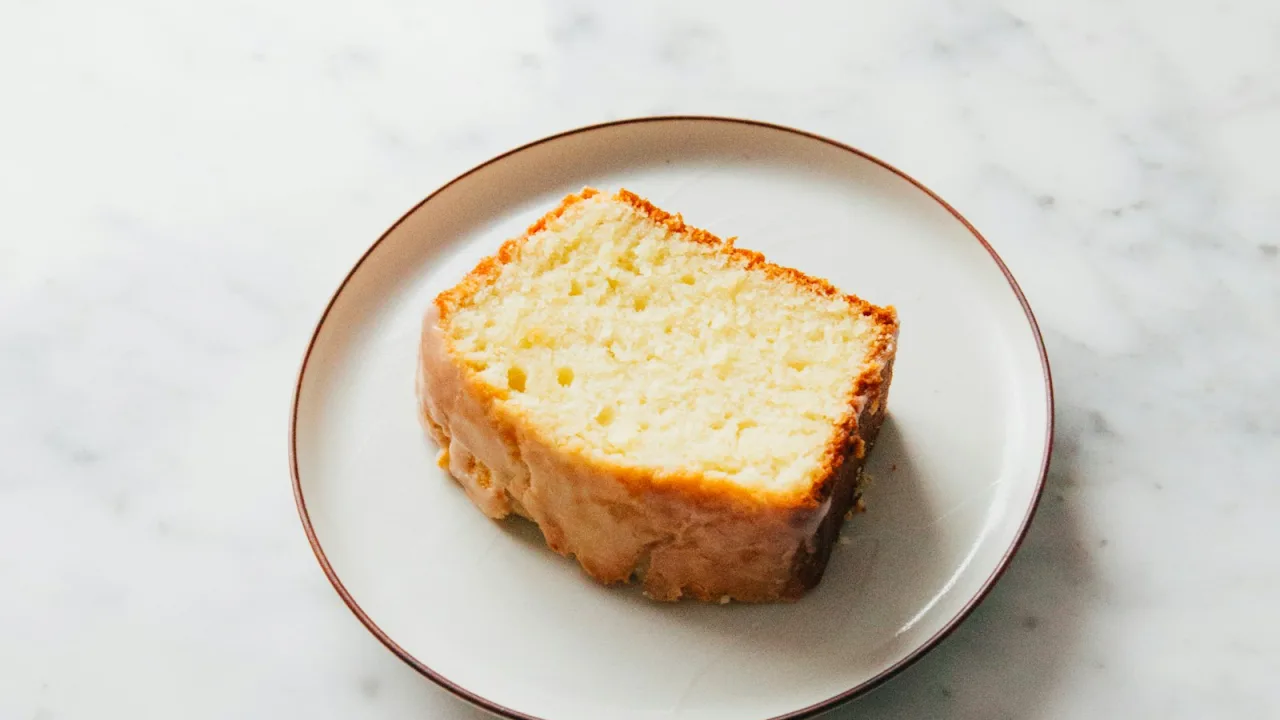 Slice of plain cake on a white plate